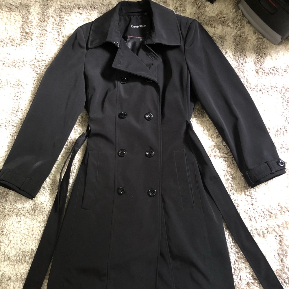 Black button down and belted trench coat